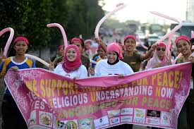 Moslem women rally to show their support for the peace talks