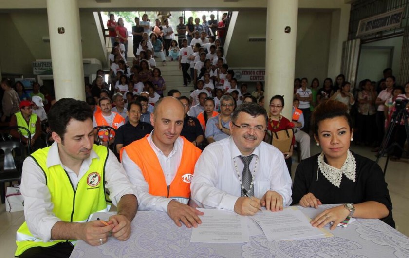 MOA signing between cioty officials and KYM vice chair, Metin Cetiner. (Courtesy of Pacific Dialogue Foundation)