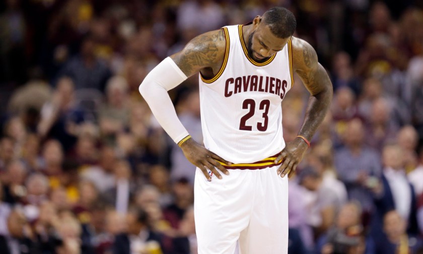 Cleveland Cavaliers forward LeBron James (23) hangs his head during the second half of Game 6 of basketball's NBA Finals against the Golden State Warriors in Cleveland, Tuesday, June 16, 2015. (AP Photo/Tony Dejak) ORG XMIT: OHMC148