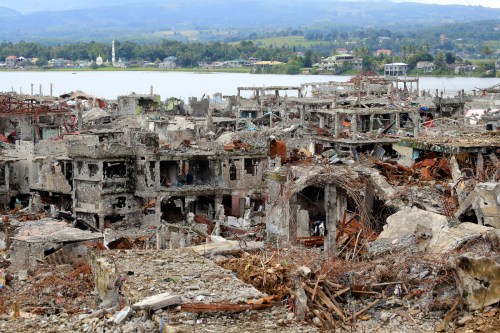 Damaged buildings and houses are seen in Marawi city